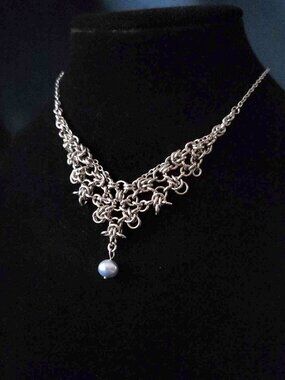 Vintage silver princess necklace with a blue pearl